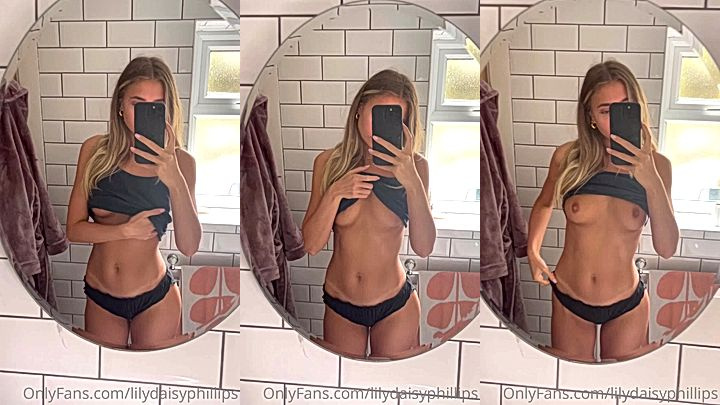 blonde babe Lillian Phillips flashing her perfect tits in the bathroom mirror