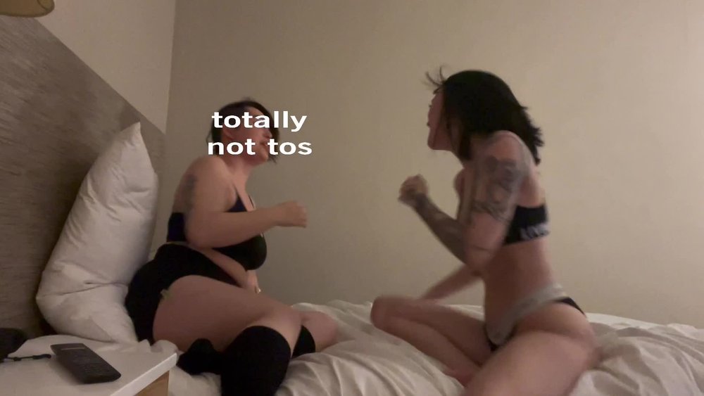essaere rolling around on bed with lesbian bff
