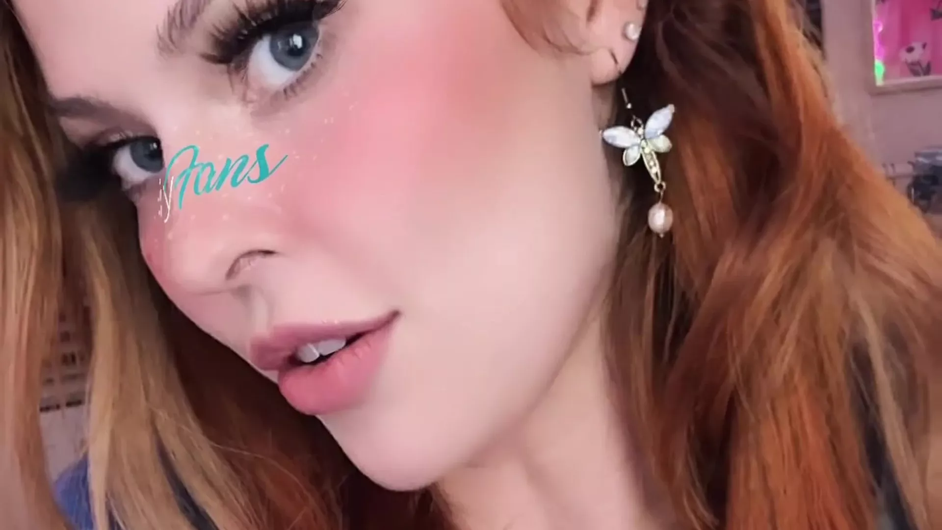 redhead girl ellyclutch showing off her new elf earing