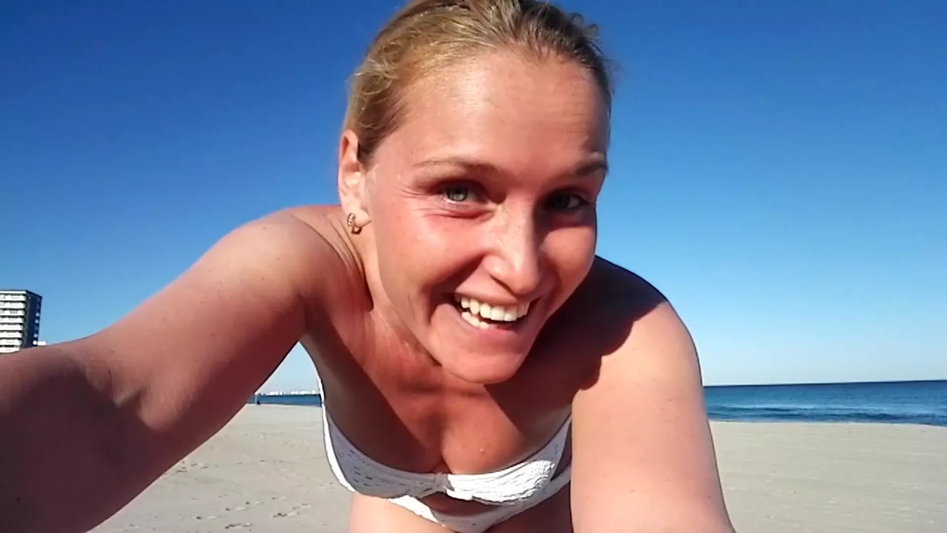 Kathia Nobili showing off her white bikini on the beach