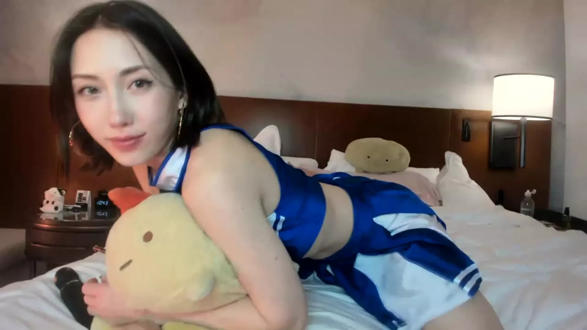 Delightfulhug teasing her hot cheerleader outfit in bed